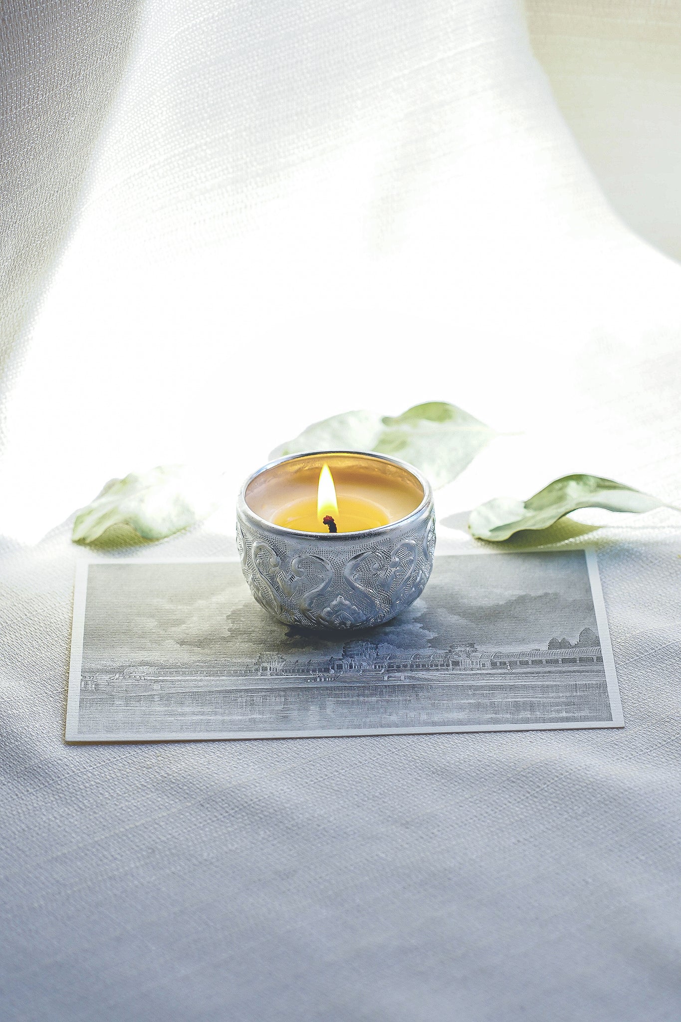 100% natural soy wax candle in stunning silver toned alms bowl
