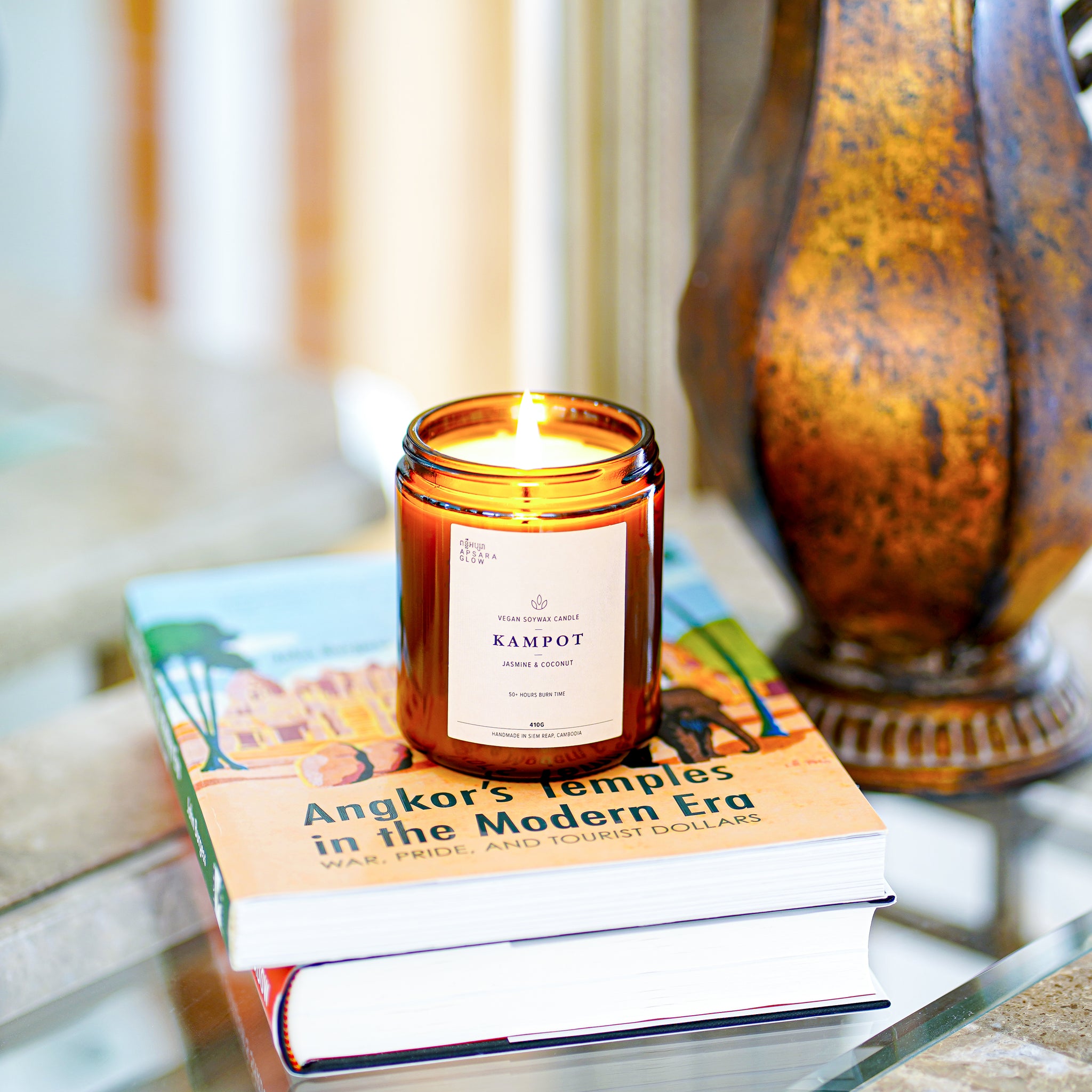 Bring charm and laid back vibe of Kampot into your space. This natural, vegan soy wax candle features floral and citrus scents of sweet jasmine blooms, nutty coconut with a hint of fresh lime. 