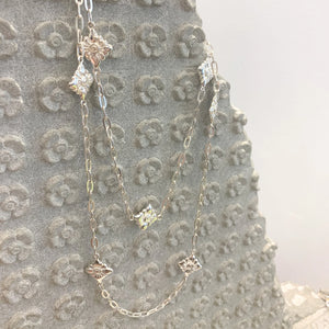 Garden of Desire - Kbach Chan Flower Silver Necklace Handcrafted in fine silver, you can wear our kbach Chan Flower statement necklace singly and long, gracefully looped or layered with other necklaces as you wish, all to beautiful effect.