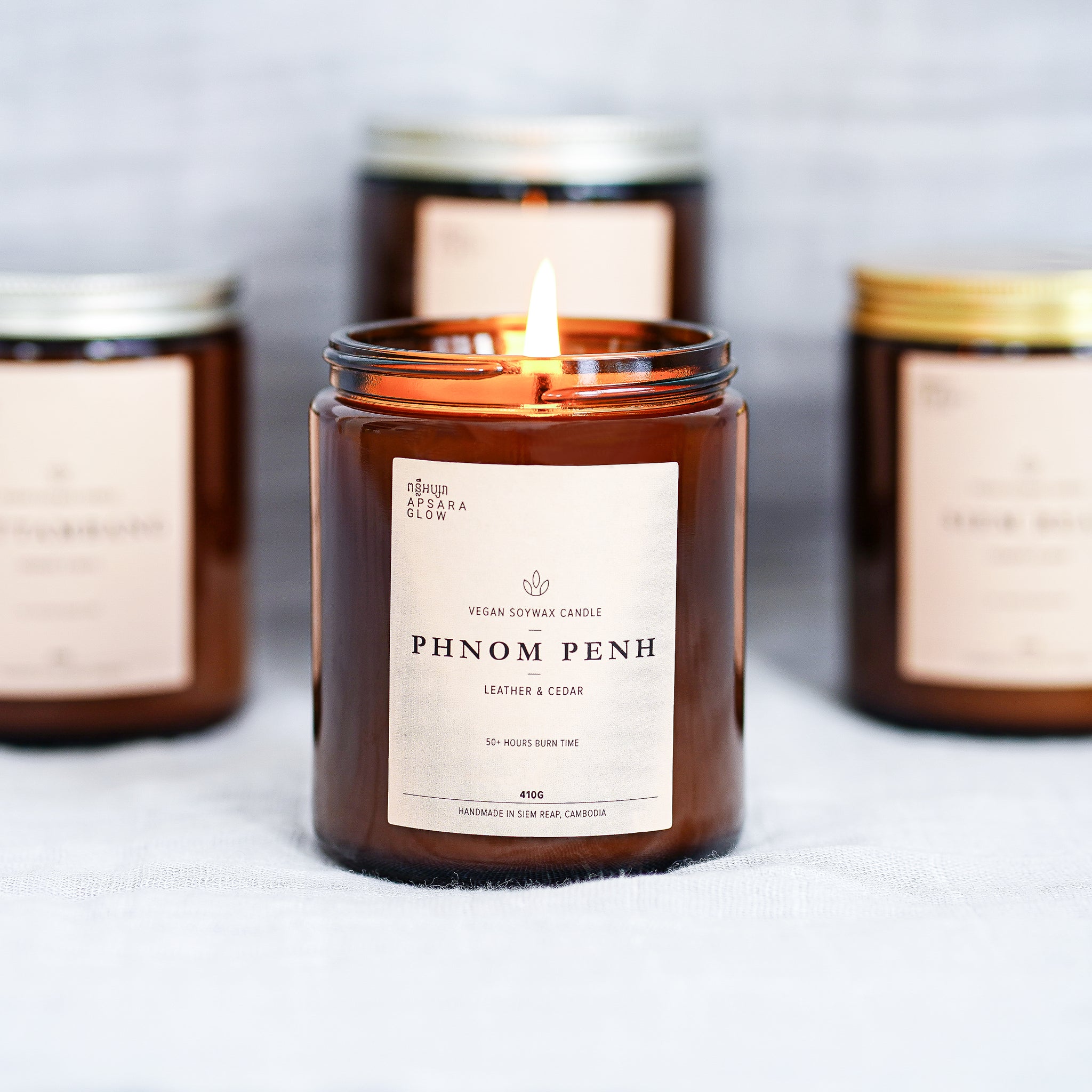 Fill your room with this woody candle. This natural, vegan soy wax candle features masculine scent of smoky leather with hints of fresh woody cedar. It is inspired by the capital of Cambodia, Phnom Penh, famously known for its bustling and robust movements.