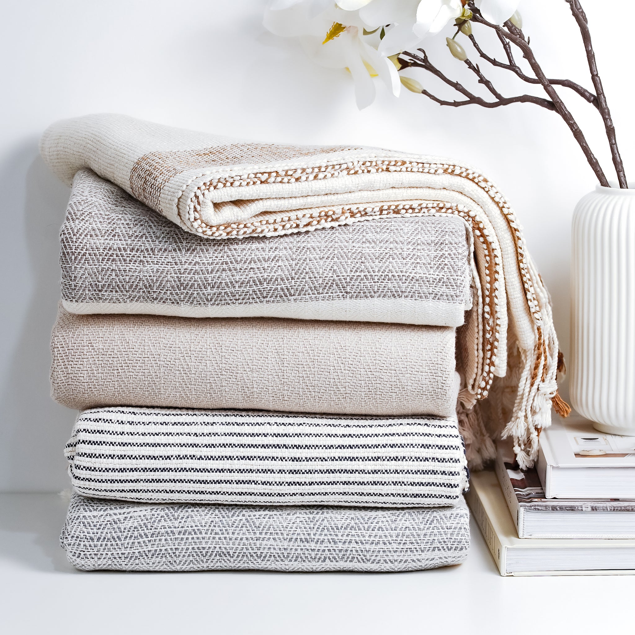 Bring comfort and style to your home with this modern and minimalist throw blanket.   This throw is large, but lightweight and perfect to cozy up with or drape over any sofa back, armchair, or foot of the bed all year long. 